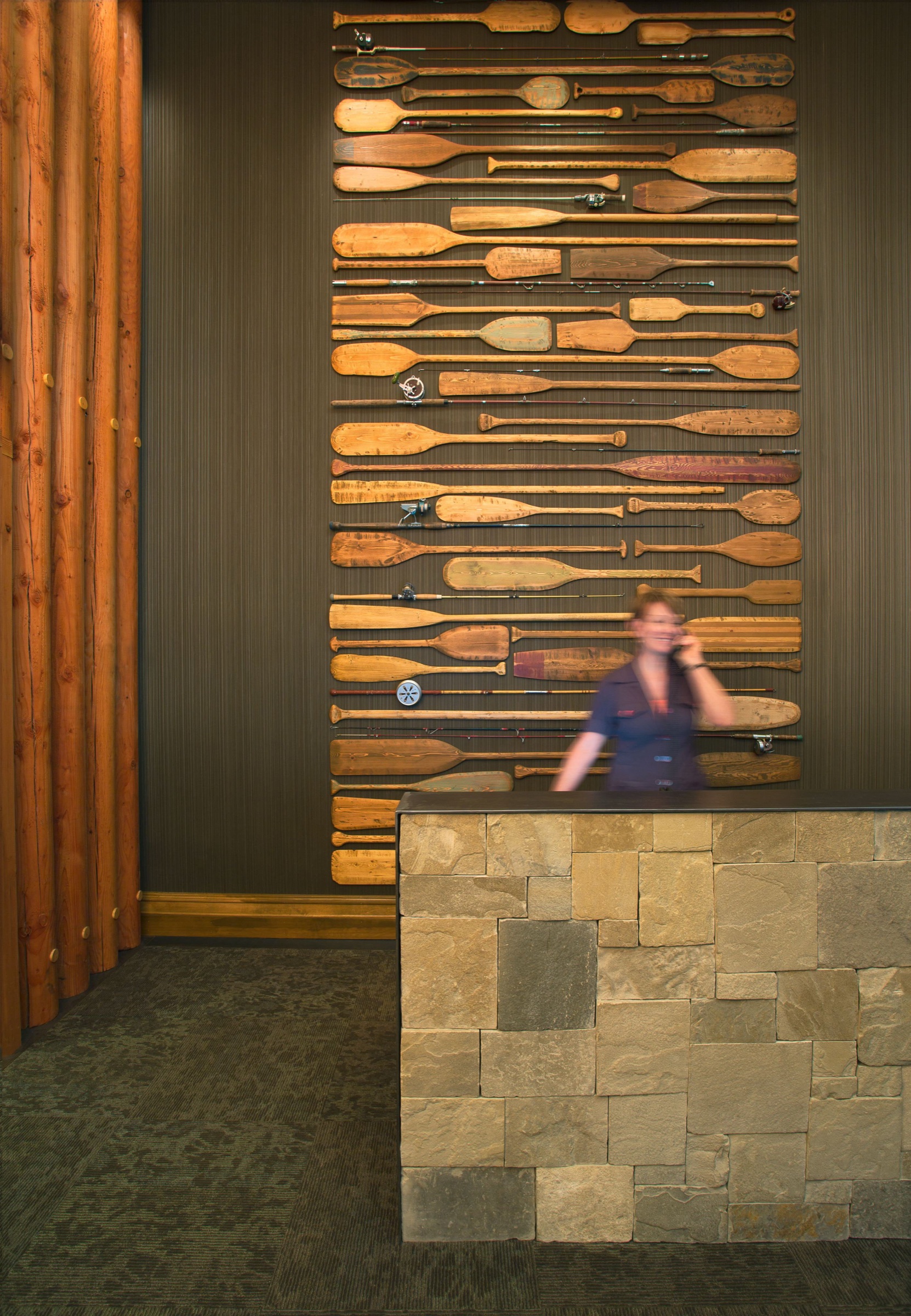 Reception area with a wall of vintage paddles